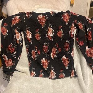 Justify juniors blouse, floral print with elastic gathers around the torso.